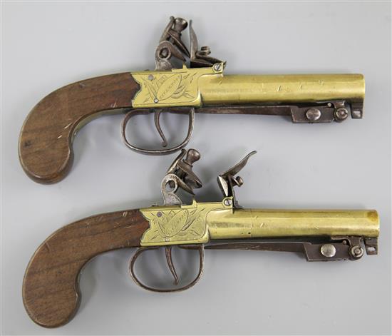 A pair of brass framed and barrelled flintlock boxlock pocket pistols, 8in. (11in with bayonet)